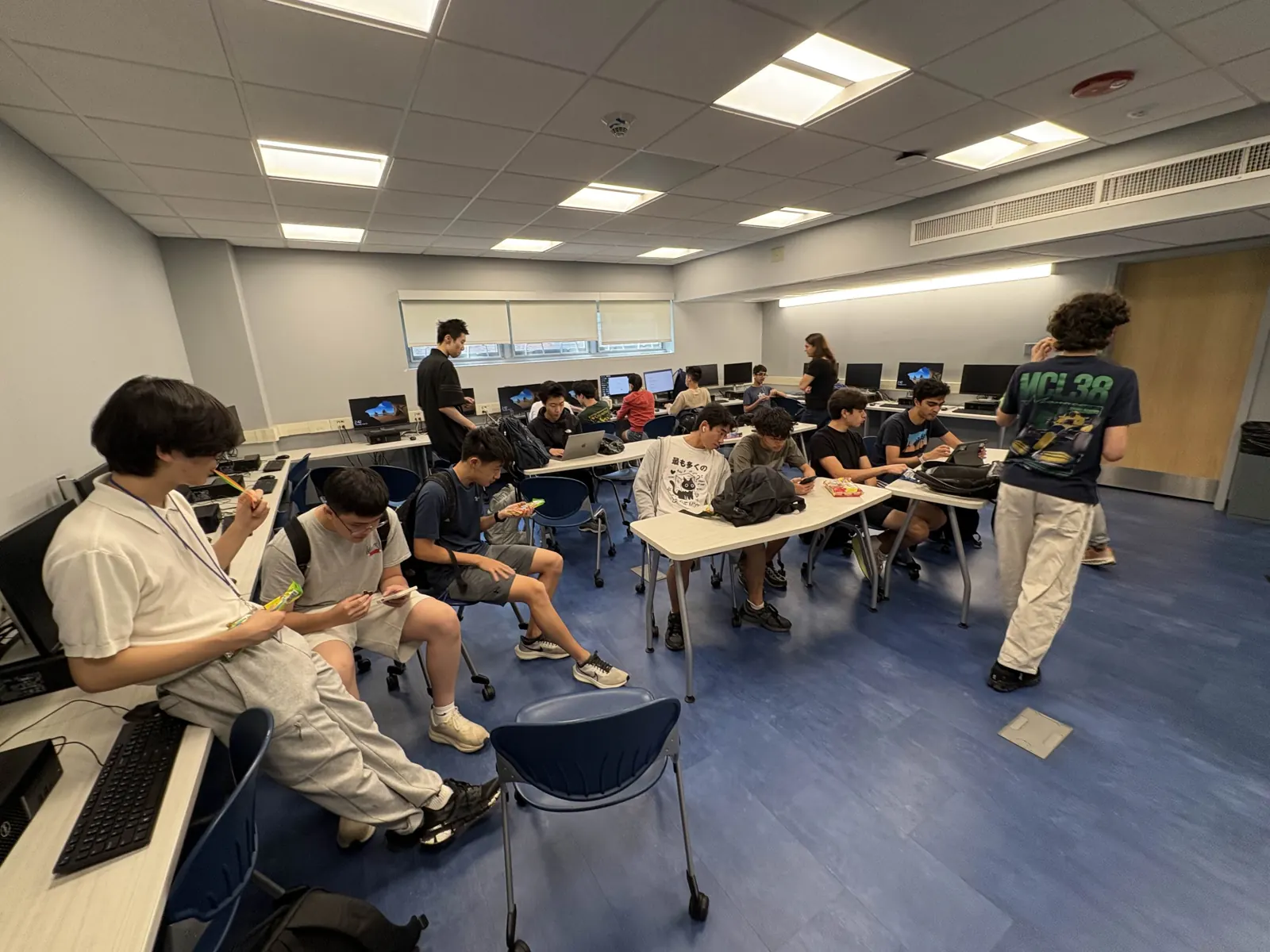 The library computer lab full of members working at their laptops