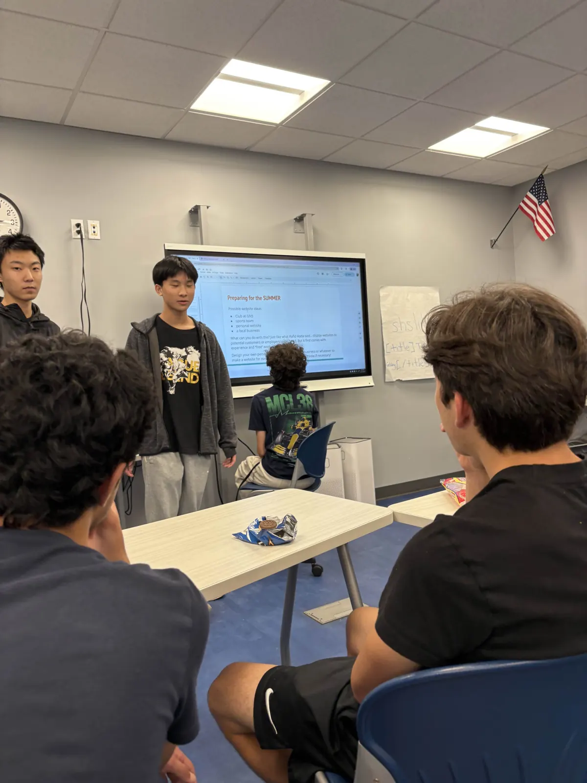 A member presenting a lesson on the smartboard to the club