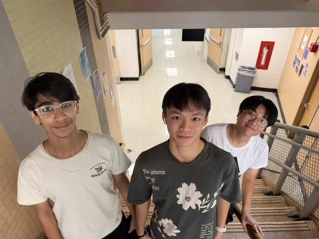 Three members in the hallway outside the lab